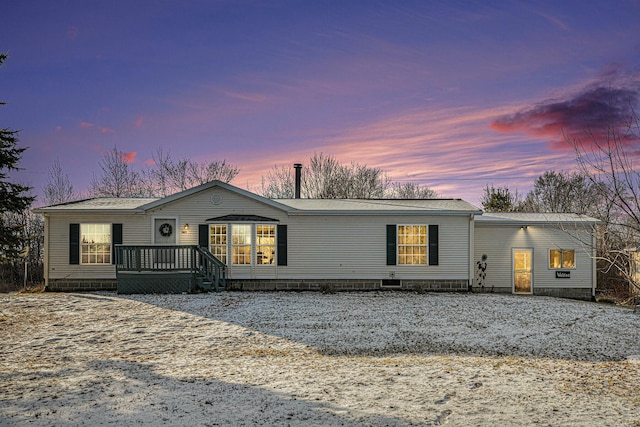 manufactured / mobile home featuring a wooden deck