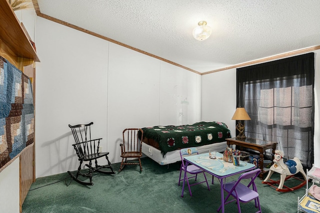 interior space with a textured ceiling, carpet floors, and ornamental molding