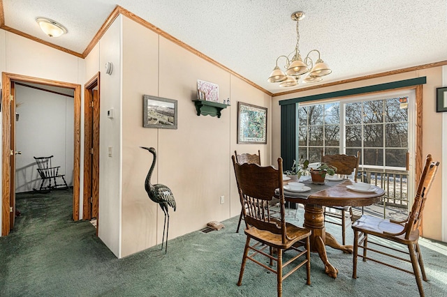 carpeted dining room featuring a textured ceiling, a chandelier, lofted ceiling, and ornamental molding