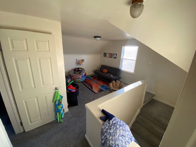 staircase featuring vaulted ceiling