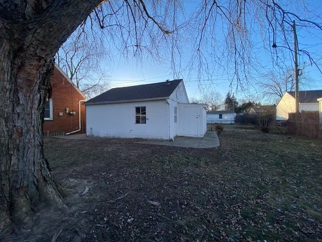 view of property exterior featuring an outbuilding