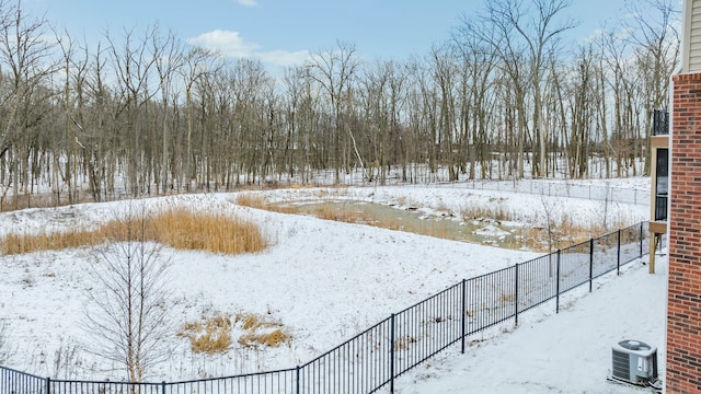 snowy yard with central air condition unit