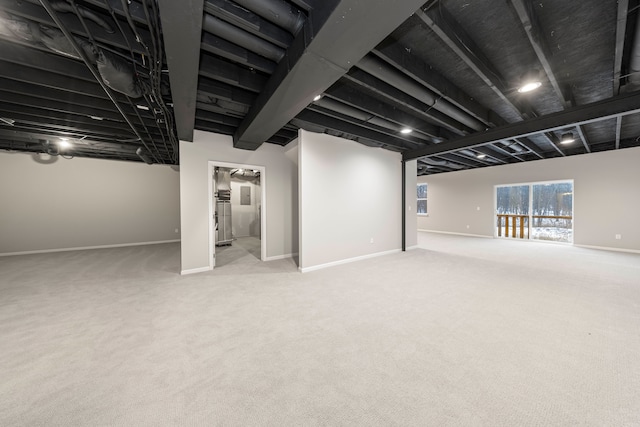 basement with light colored carpet