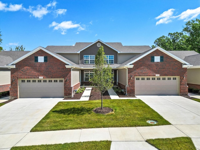 view of front facade with a garage and a front yard