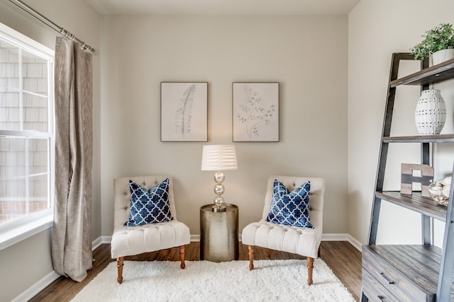 sitting room with hardwood / wood-style floors