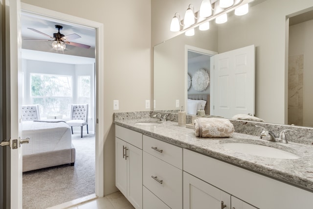 bathroom with ceiling fan and vanity