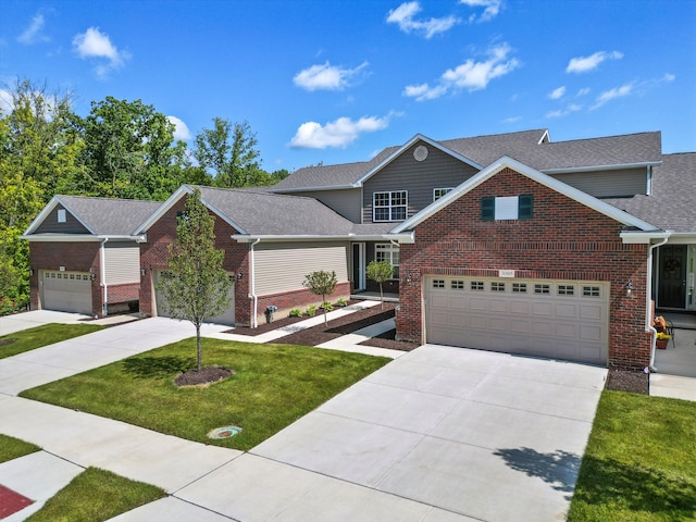 view of front of home with a garage and a front yard