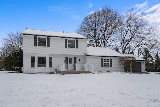 view of snow covered house