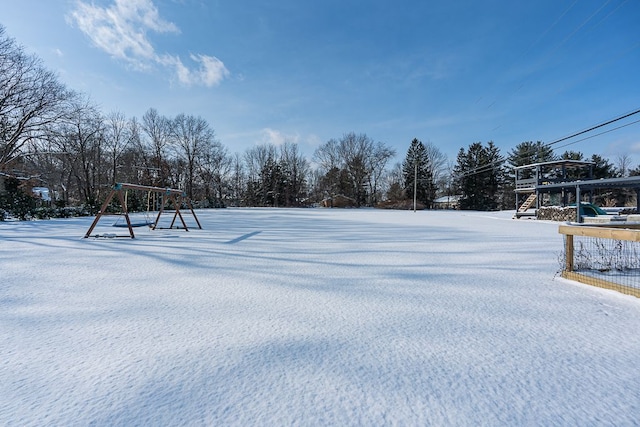 view of yard layered in snow