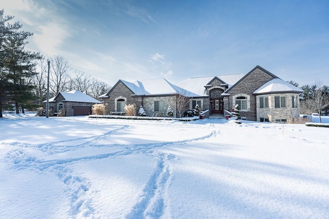 french country home featuring a garage