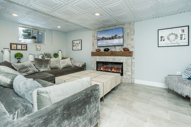 living room with a stone fireplace