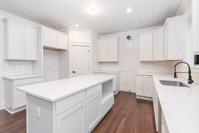 kitchen with white cabinetry and sink