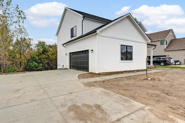 view of side of home with a garage