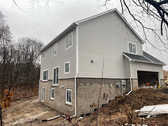 view of side of property with a garage