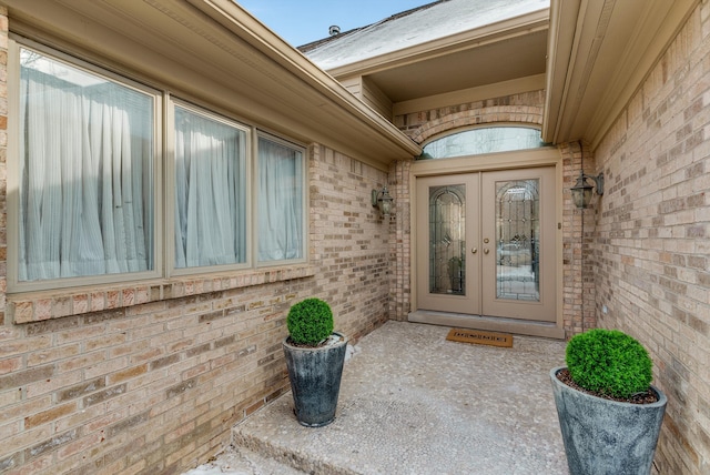 property entrance featuring french doors