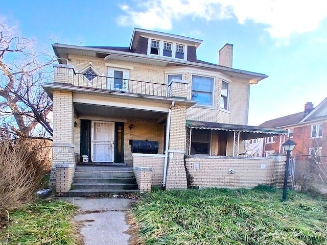 view of front of home with a balcony