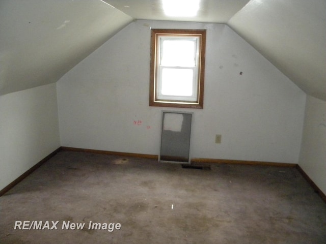 bonus room featuring vaulted ceiling