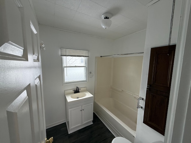 full bathroom featuring vanity, hardwood / wood-style flooring, toilet, and shower / bathtub combination