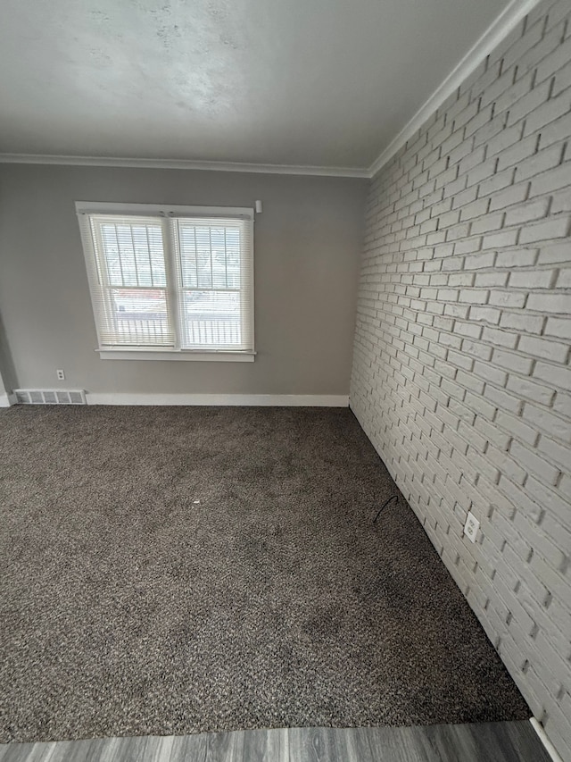 unfurnished room with ornamental molding