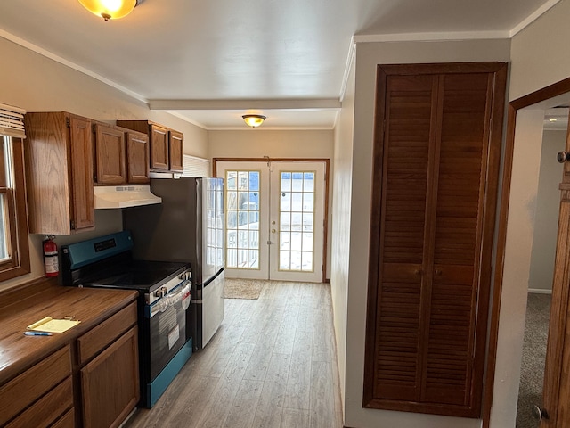 kitchen with french doors, ornamental molding, light hardwood / wood-style floors, black range with electric stovetop, and butcher block counters