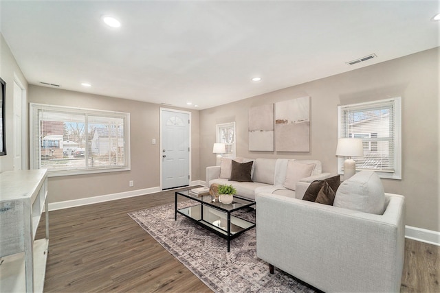 living room featuring dark wood-type flooring