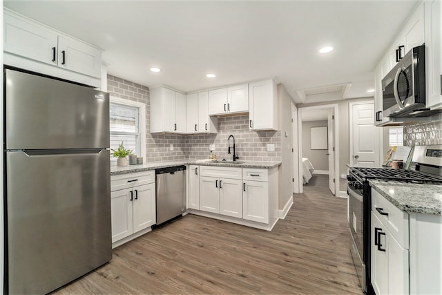 kitchen featuring white cabinetry, appliances with stainless steel finishes, and sink