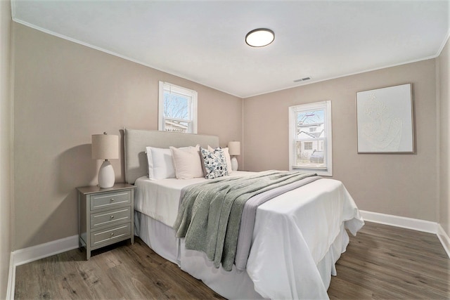 bedroom with dark wood-type flooring