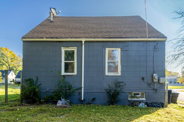 view of home's exterior with a yard