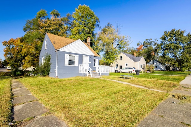 bungalow-style house with a front yard