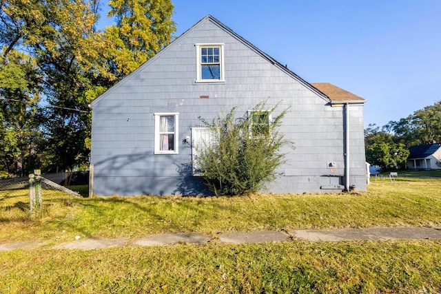 view of home's exterior with a lawn