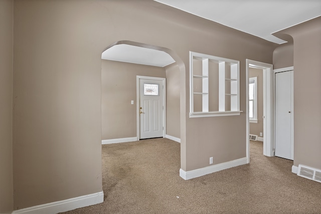 entryway featuring carpet flooring