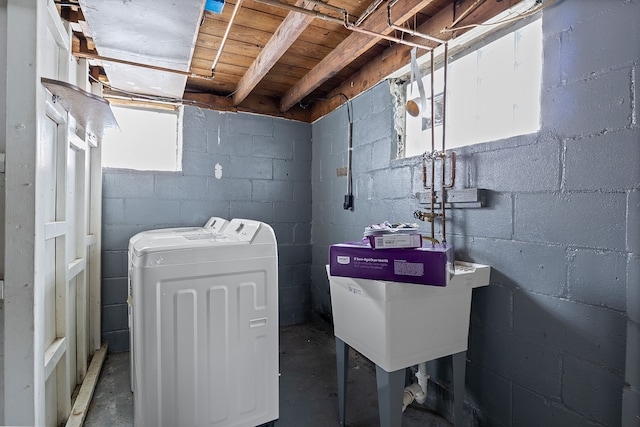 washroom featuring separate washer and dryer and sink