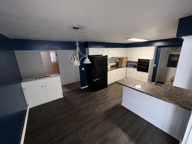 kitchen featuring white cabinetry, dark hardwood / wood-style flooring, kitchen peninsula, pendant lighting, and black appliances