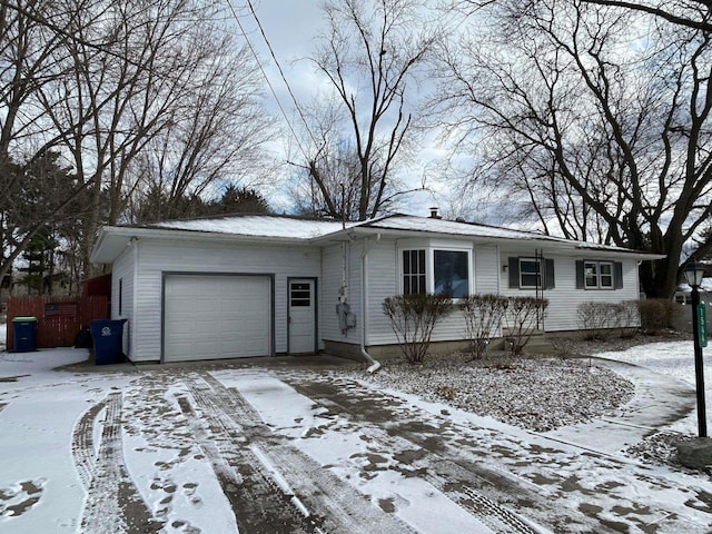 ranch-style home featuring a garage