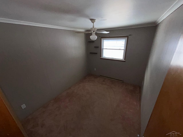 unfurnished room featuring ceiling fan, ornamental molding, and a baseboard heating unit