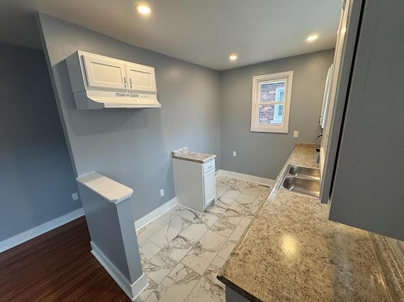 kitchen with sink and white cabinets