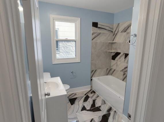 full bathroom featuring vanity, shower / bath combination, and toilet