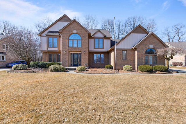 view of front facade featuring a front lawn and brick siding