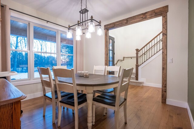 dining room featuring a notable chandelier and wood-type flooring