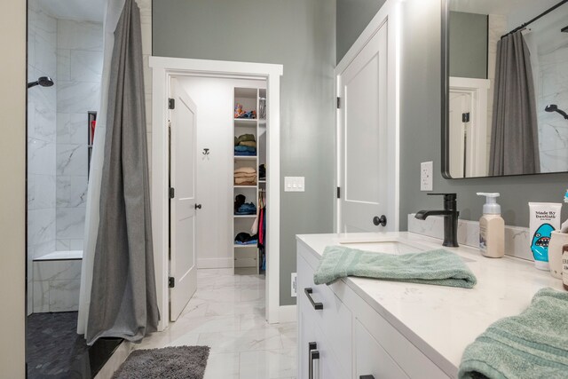 bathroom featuring vanity and curtained shower