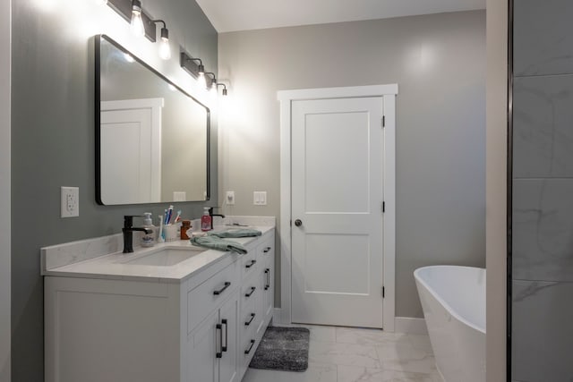 bathroom featuring vanity and a washtub