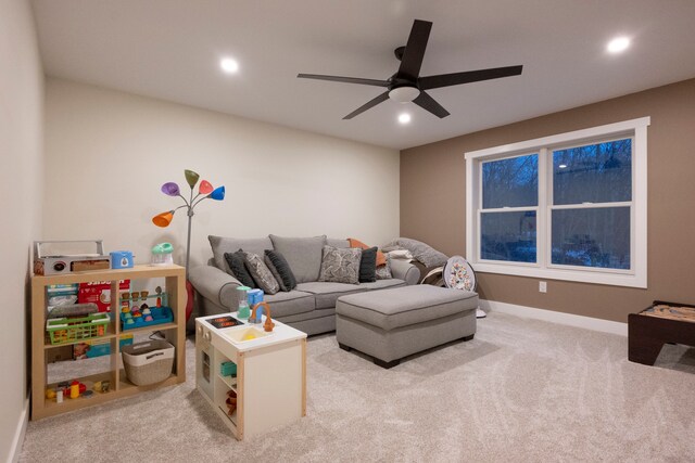 living room with light colored carpet and ceiling fan