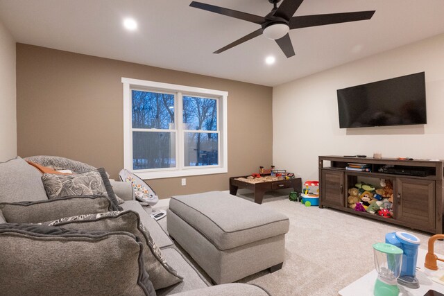 living room featuring carpet floors and ceiling fan