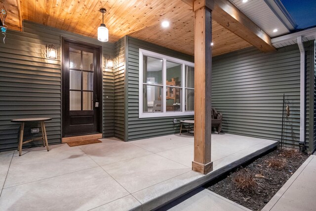 entrance to property featuring a patio