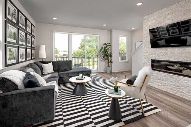 living room with a fireplace and light hardwood / wood-style floors