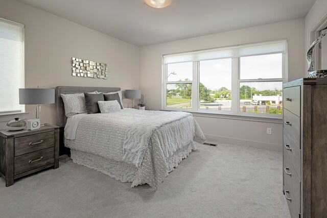 bedroom with light colored carpet