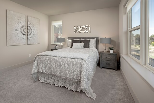 bedroom featuring light carpet