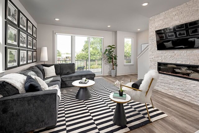 living room featuring a fireplace and light hardwood / wood-style flooring