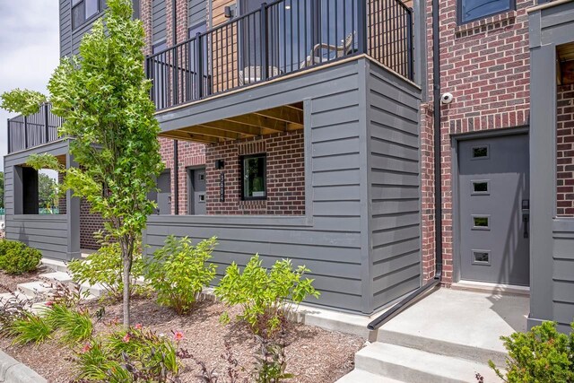 view of property exterior featuring a balcony