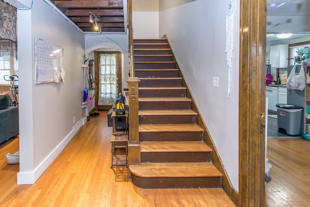 staircase featuring hardwood / wood-style floors